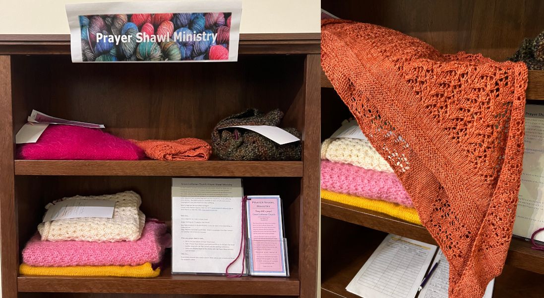 shelf with folded shawls and unfolded orange shawl